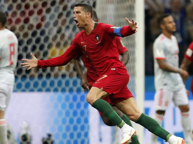 Portugal's Cristiano Ronaldo celebrates after he scored his third goal with a free kick during the group B match between Portugal and Spain at the 2018 soccer World Cup in the Fisht Stadium in Sochi, Russia, Friday, June 15, 2018. (AP Photo/Frank Augstein)