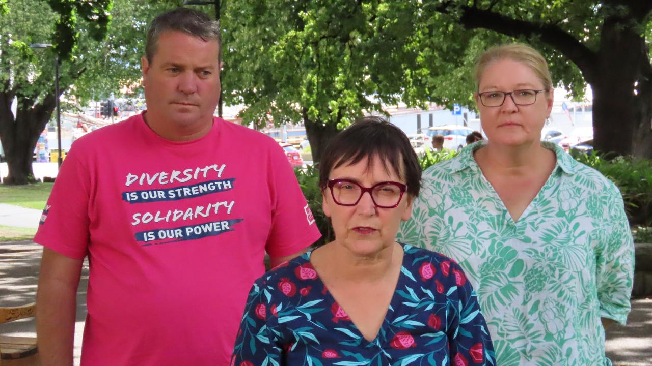 HACSU state secretary Robbie Moore with Greens MP Helen Burnet and UWU representative Amy Brumby on Parliament Lawns in Hobart on Thursday, January 30, 2025.