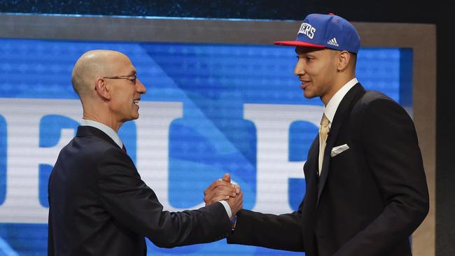 NBA Commissioner Adam Silver, left, congratulates Ben Simmons after he was selected as the top pick in Friday’s NBA Draft. Picture: AP