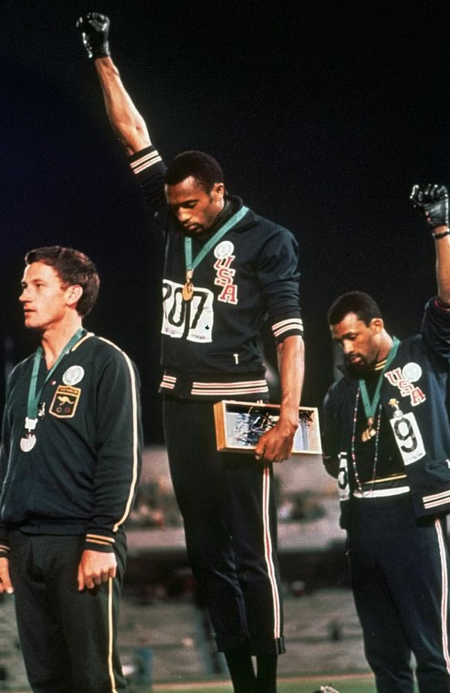 Peter Norman with Tommie Smith and John Carlos on the podium. Picture: AP