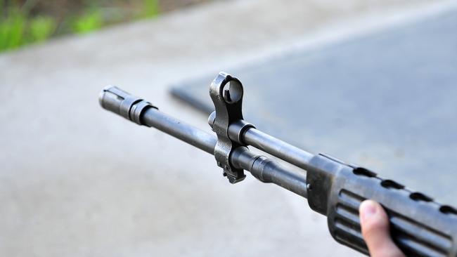 Police allegedly found a modified rifle on May 22.