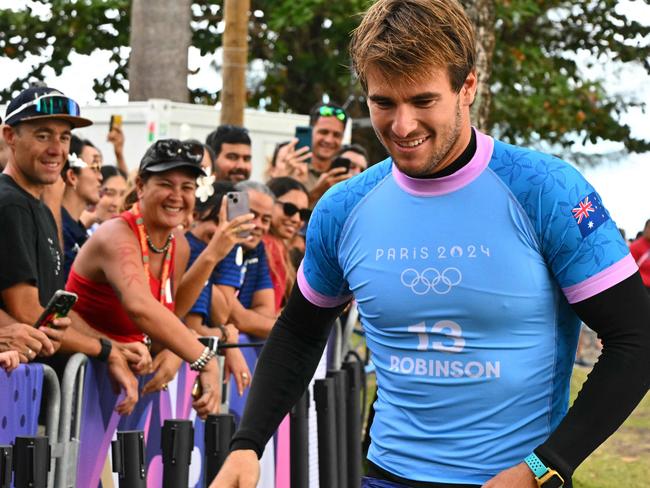 Australia's Jack Robinson walks to the podium after taking the silver in the men's surfing, during the Paris 2024 Olympic Games, in Teahupo'o, on the French Polynesian Island of Tahiti, on August 5, 2024. (Photo by Jerome BROUILLET / AFP)