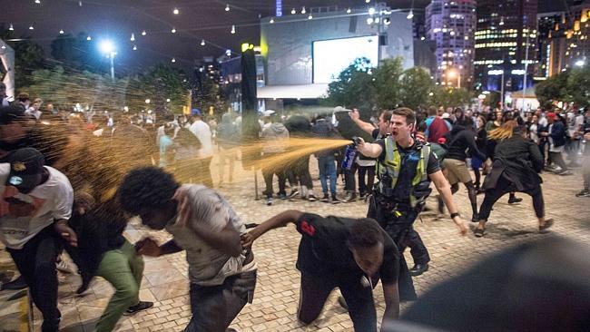 A brawl erupts at Federation Square during Moomba festivities.