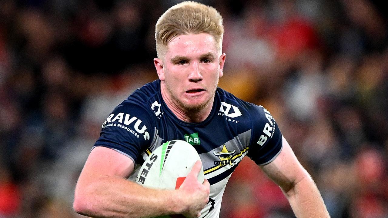 BRISBANE, AUSTRALIA – AUGUST 25: Tom Dearden of the Cowboys breaks away from the defence during the round 26 NRL match between Dolphins and North Queensland Cowboys at Suncorp Stadium on August 25, 2023 in Brisbane, Australia. (Photo by Bradley Kanaris/Getty Images)