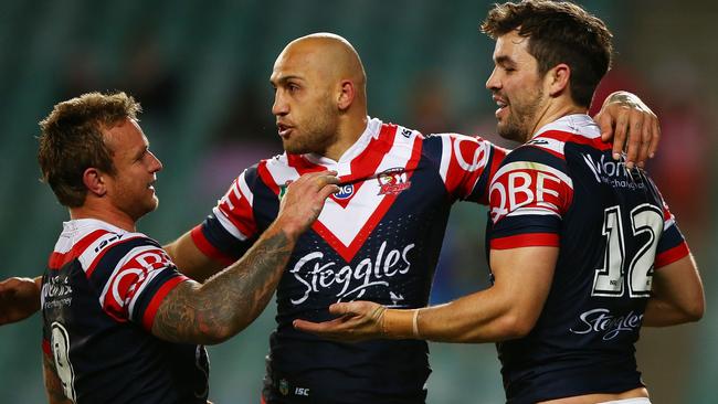 SYDNEY, AUSTRALIA — AUGUST 19: Aidan Guerra (R) of the Roosters is congratulated by Blake Ferguson (C) and Jakob Friend of the Roosters after scoring a try during the round 24 NRL match between the Sydney Roosters and the Wests Tigers at Allianz Stadium on August 19, 2017 in Sydney, Australia. (Photo by Matt Blyth/Getty Images)