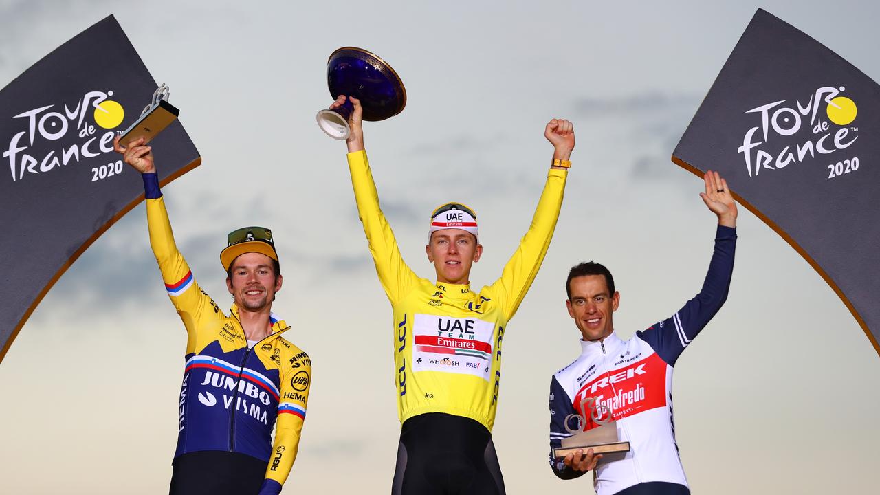Primoz Roglic of Slovenia in second place (left), winner Tadej Pogacar of Slovenia (centre) and Richie Porte of Australia (right) in third place on the podium after the 107th Tour de France 2020, Stage 21 from Mantes-La-Jolie to Paris Champs Elysees on September 20, 2020 in Paris, France. Picture: Getty Images