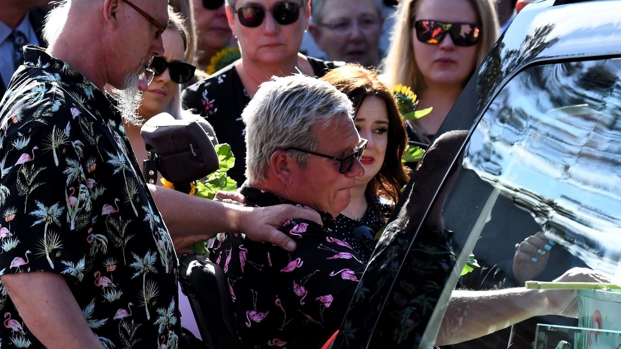 Lily's father John places his hand on her coffin on Friday. Picture: Picture: Backgrid via NCA NewsWire