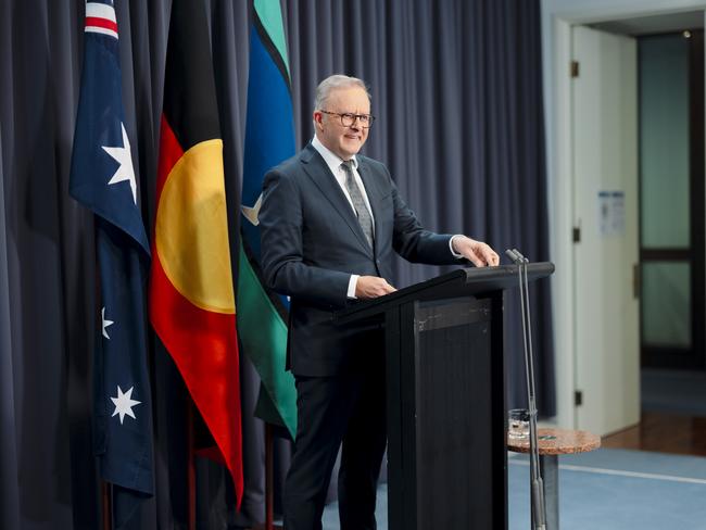 Prime Minister Anthony Albanese in font of the three flags at a press conference in Canberra. Picture: NewsWire / David Beach