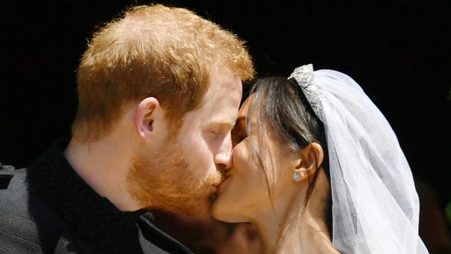 Prince Harry and Meghan Markle kiss on the steps of St George's Chapel in Windsor Castle after their wedding. 19 May 2018 Pictured: Prince Harry, Meghan Markle. Photo credit: Ben Birchall/WPA/MEGA  TheMegaAgency.com +1 888 505 6342