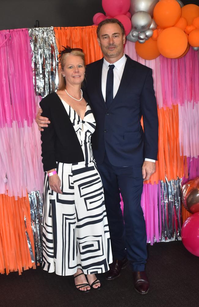 Janelle and Simon Graham at the Rockhampton Jockey Club's Pink Ribbon Stradbroke Charity Race Day at Callaghan Park on June 15, 2024.