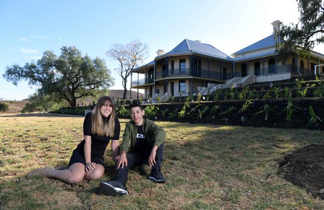 Jade and Louis Hall on the grounds of homestead. Picture: Simon Bullard