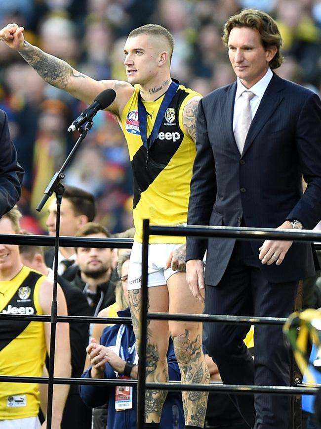 James Hird presents Dustin Martin with the Norm Smith Medal. Picture: Nicole Garmston