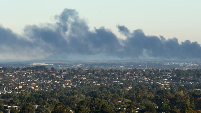 The fire is sending thick black smoke across Melbourne's north. Picture: Tony Gough