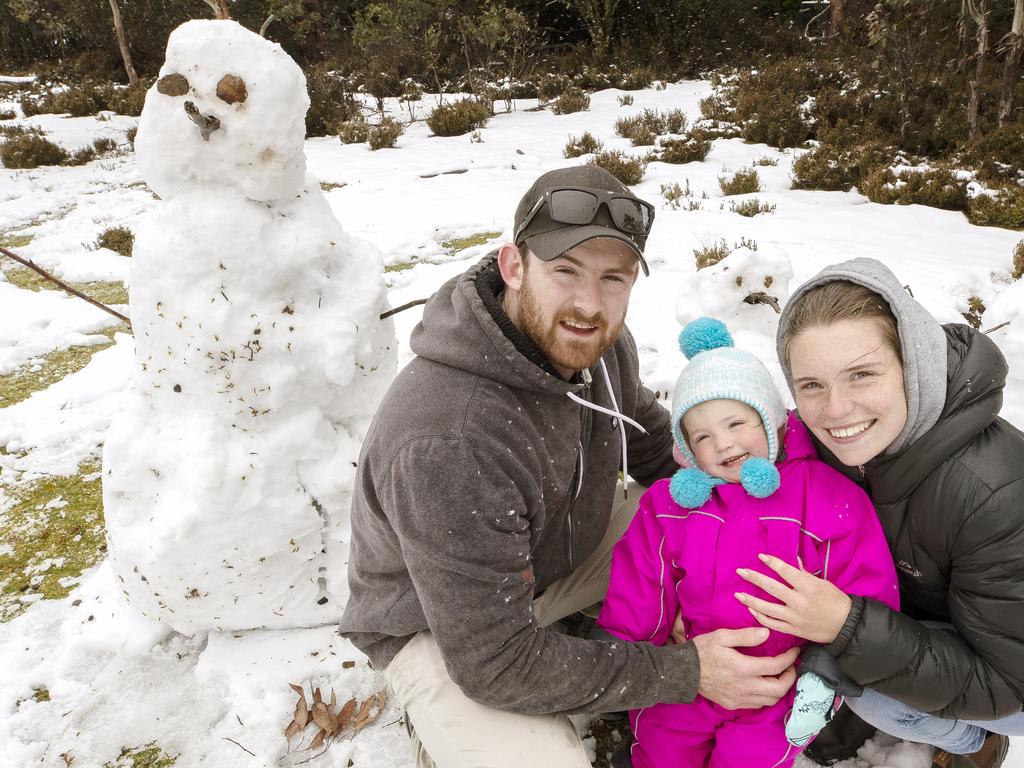 Corey Rowell, Chelsea Hingston and Annie Hingston- Rowell 2 enjoy the snow at Cradle Mountain. PICTURE CHRIS KIDD