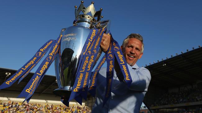 Gary Lineker poses for a picture with the Premier League Trophy prior to the season.