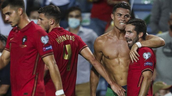 Cristiano Ronaldo celebrates with his teammates after scoring against Ireland. Picture: AFP