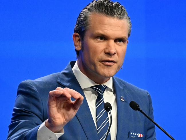 TOPSHOT - US Secretary of Defense Pete Hegseth delivers an address at the Shangri-La Dialogue Summit in Singapore on May 31, 2025. (Photo by MOHD RASFAN / AFP)