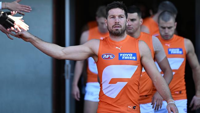 LAUNCESTON, AUSTRALIA - JUNE 08: Toby Greene of the Giants leads out the team during the round 13 AFL match between Hawthorn Hawks and GWS GIANTS at University of Tasmania Stadium, on June 08, 2024, in Launceston, Australia. (Photo by Steve Bell/Getty Images)