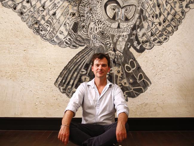 Joshua Yeldham with artwork, Surrender - Yeoman's Bay, 2014 at the Manly gallery.