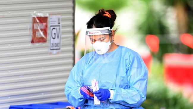 A health worker performs duties at a Covid-19 testing clinic in Brisbane. Picture: NCA NewsWire / Dan Peled