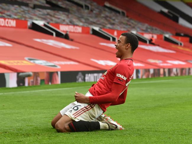 Manchester United's English striker Mason Greenwood celebrates after scoring a goal during the English Premier League football match between Manchester United and Bournemouth at Old Trafford in Manchester, north west England, on July 4, 2020. (Photo by PETER POWELL / POOL / AFP) / RESTRICTED TO EDITORIAL USE. No use with unauthorized audio, video, data, fixture lists, club/league logos or 'live' services. Online in-match use limited to 120 images. An additional 40 images may be used in extra time. No video emulation. Social media in-match use limited to 120 images. An additional 40 images may be used in extra time. No use in betting publications, games or single club/league/player publications. /