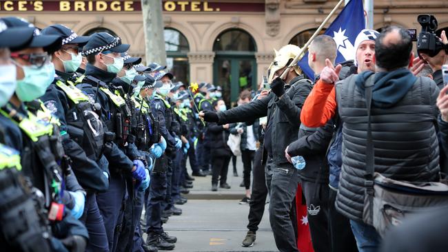 Protesters against the police line. Picture Rebecca Michael.