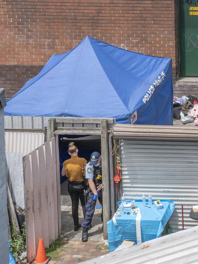 Police set up a tent at the rear of the property while investigating.