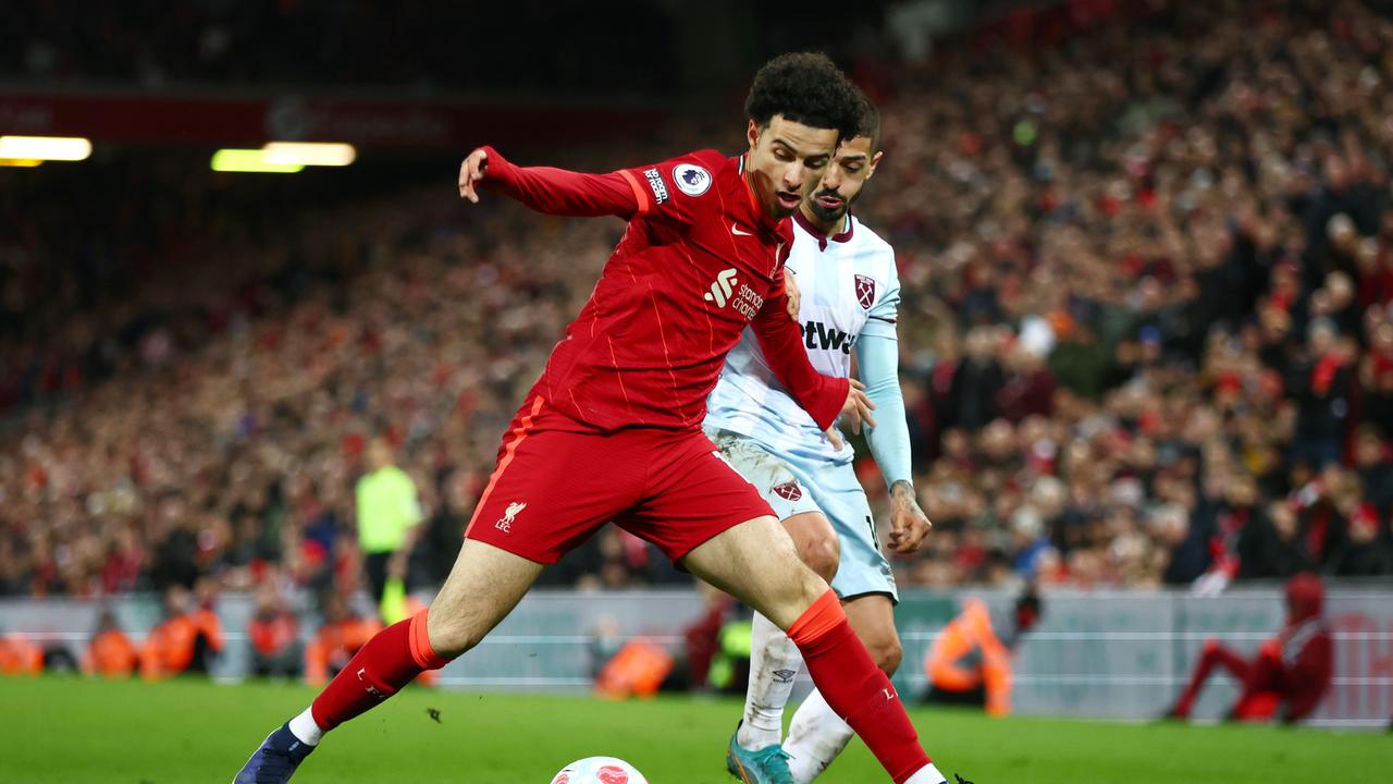 LIVERPOOL, ENGLAND - MARCH 05: Curtis Jones of Liverpool battles for possession with Manuel Lanzini of West Ham United during the Premier League match between Liverpool and West Ham United at Anfield on March 05, 2022 in Liverpool, England. (Photo by Clive Brunskill/Getty Images)