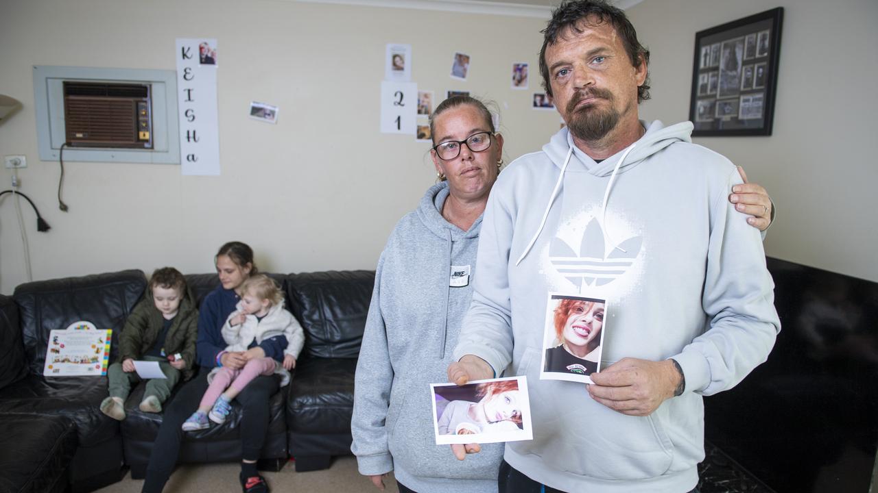 Matt Smith holds photos of his daughter, Keisha, who took her own life in March. Mr Smith is with his partner Mel Beal and daughter Shakira Smith, holding his daughter Letty-Maree, 2, and Keisha’s son Elijah, 3. Picture: Mark Brake.