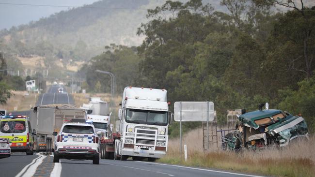 Emergency services at the scene of a two-truck crash on the Capricorn Highway at Kabra.