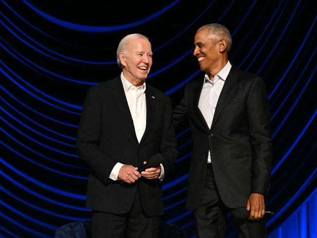 Joe Biden froze on before he was helped off stage by Barack Obama. Picture: AFP