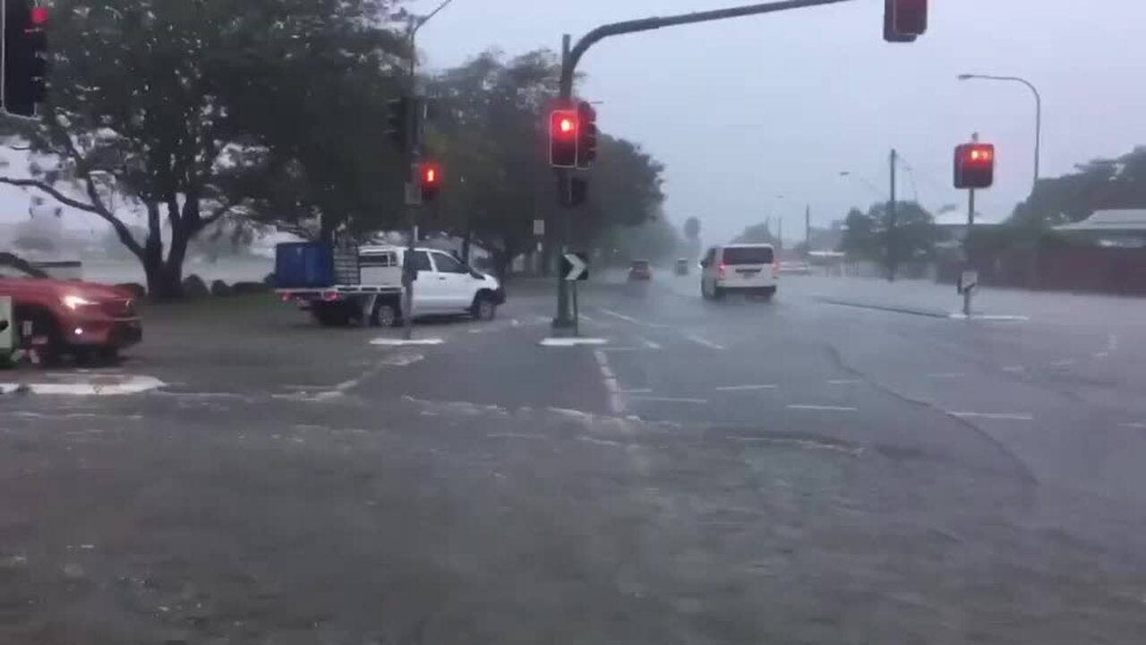 Cars drive through flooded streets as Townsville hit with deluge