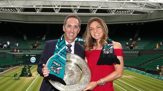 Wimbledon women's singles champion Simona Halep and former coach and Port Adelaide board member Darren Cahill with the winner's trophy. Picture: Port Adelaide FC/Twitter.