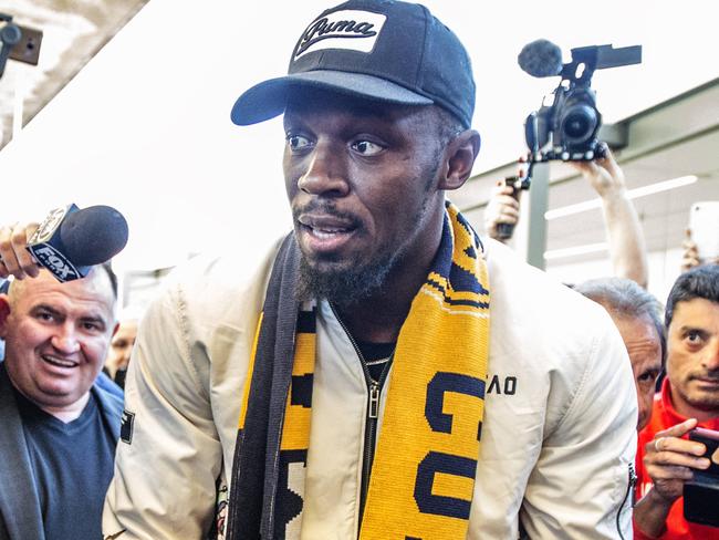 Usain Bolt arrives at Sydney International airport this morning ahead of his stint with the Central Coast Mariners. Pic Jenny Evans