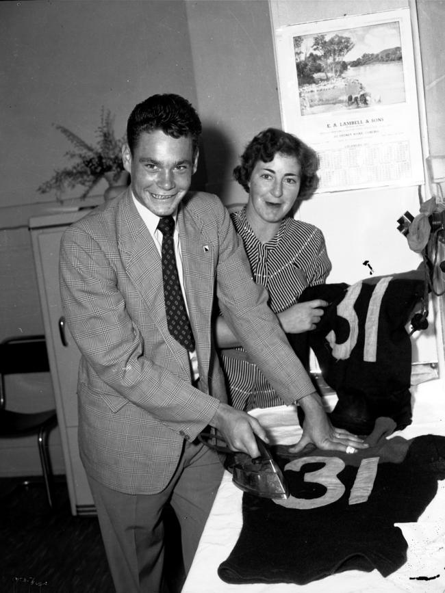 Barassi irons his team jumper before his first game.