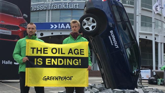 Greenpeace protesters outside the Frankfurt motor show. Photo: Joshua Dowling