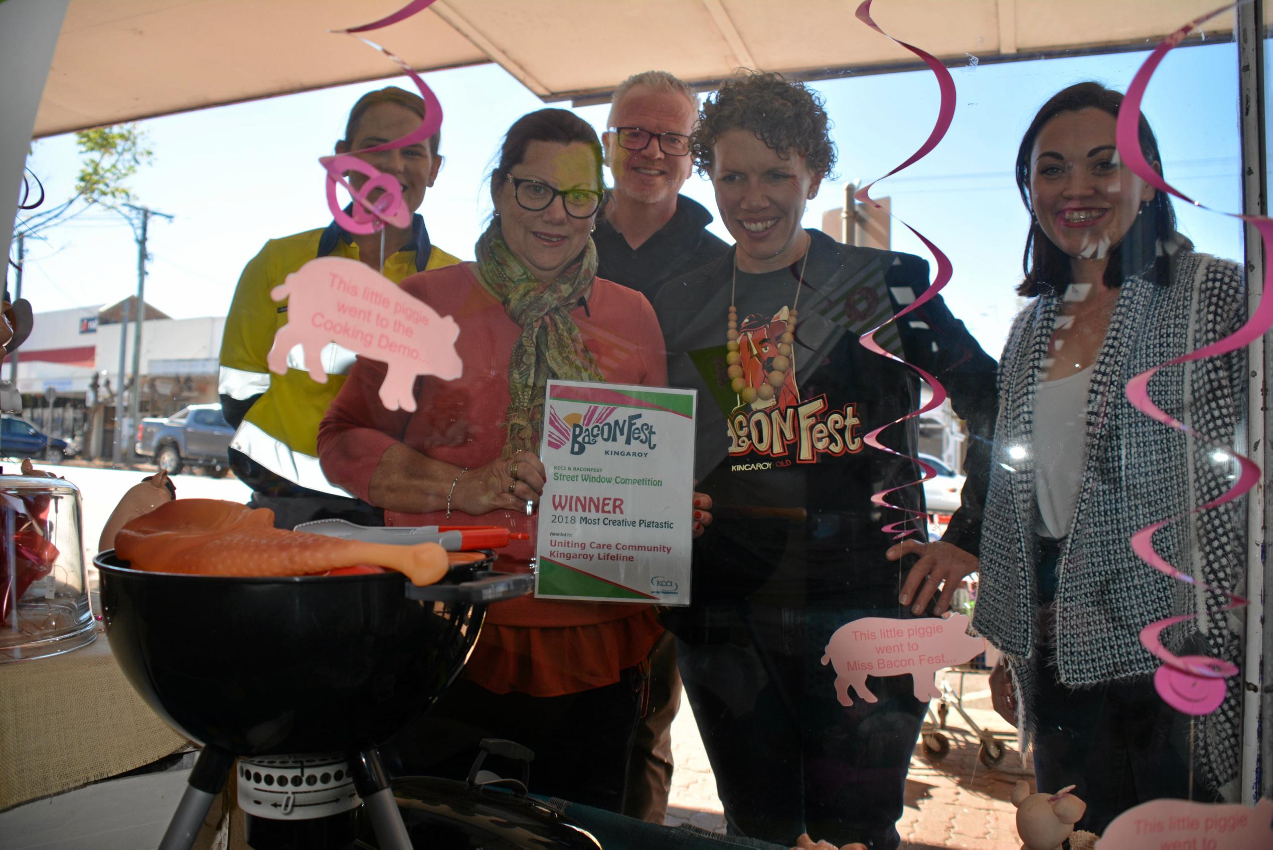 WINNER: Kirstie Schumacher, Debbie Cox, Rob Fitz-Herbert,  Kath Stevens and Felicity Cavill admire Lifeline's most creative pigtastic window. Picture: Jessica McGrath