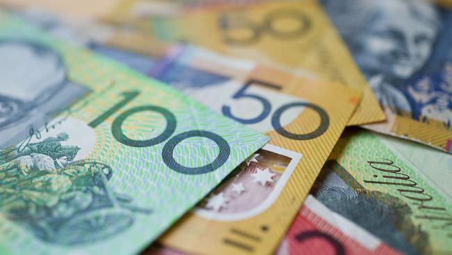 Australian money background showing $100, $50 and $20 notes with a shallow depth of field.