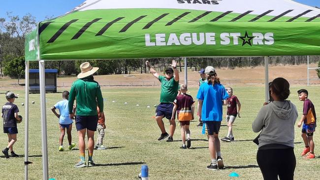 Young footballers enjoyed participating in an NRL clinic after seeing the impressive Provan-Summons grand final trophy at the Redbank Plains fields. Picture: David Lems