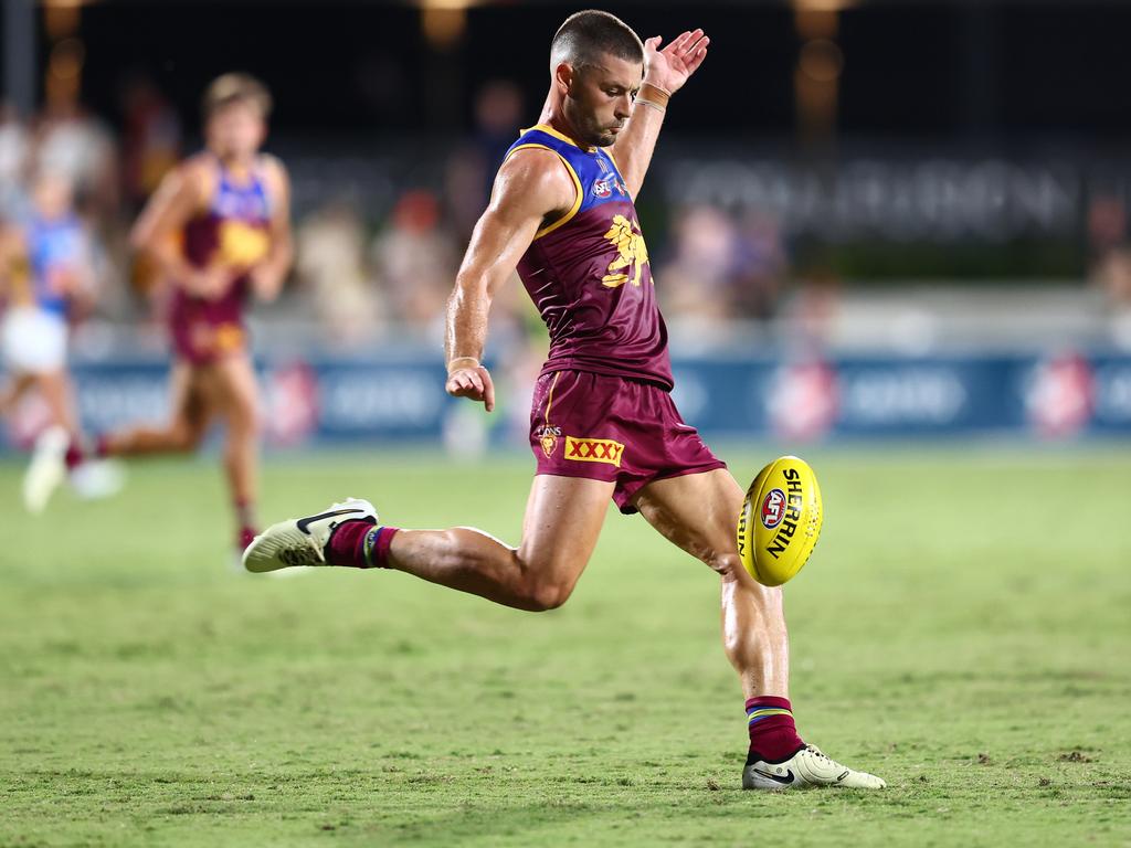 Lions star Josh Dunkley unleashes a kick during his side’s practice match win over the Suns. Picture: Chris Hyde/Getty Images