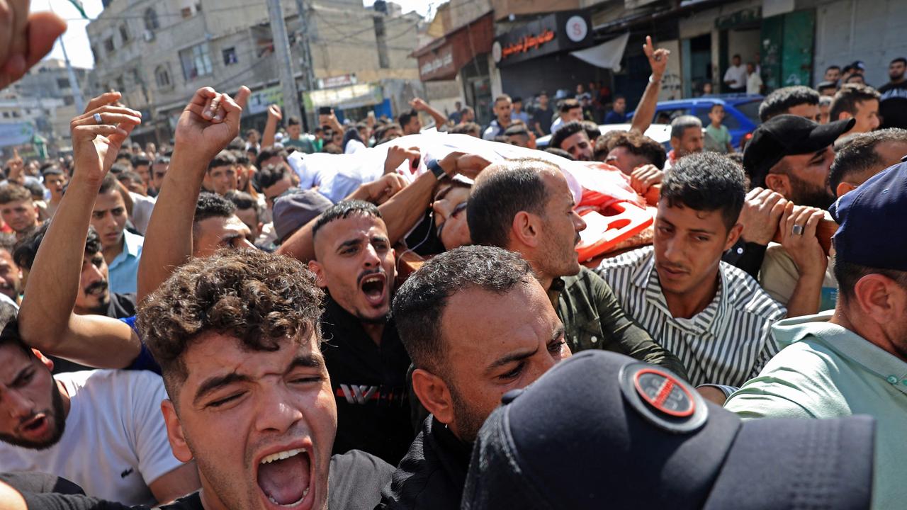 Palestinians carry the body of a victim that was killed in an Israeli strike, in Khan Yunis in the southern Gaza Strip. Picture: AFP