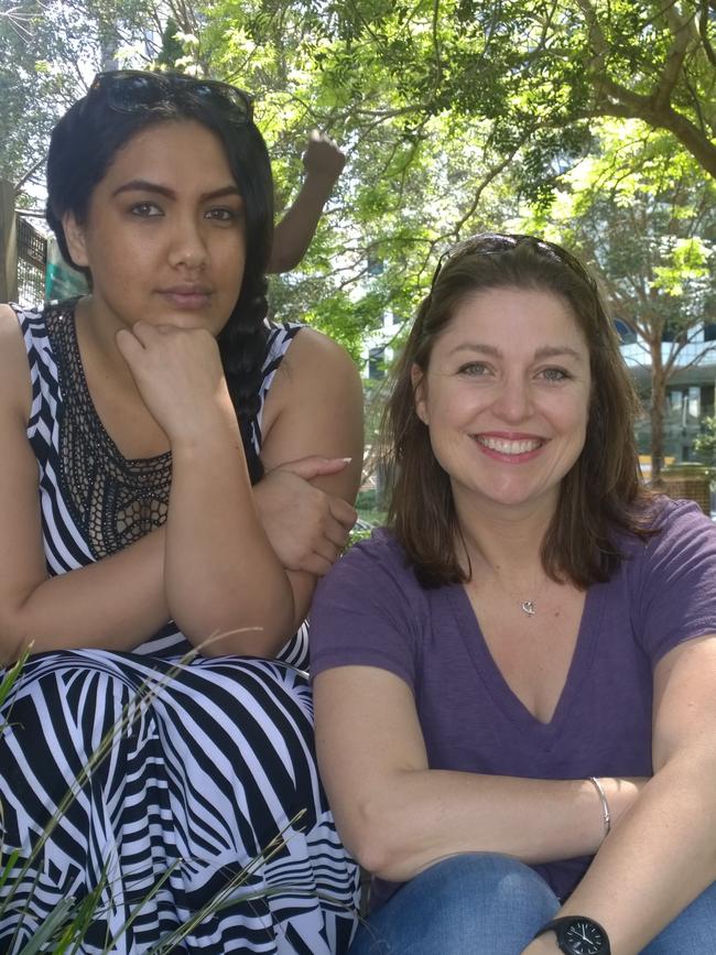 Kate Kesby helps mums like Modesty Timu (left) in her volunteer work with Raise Foundation.