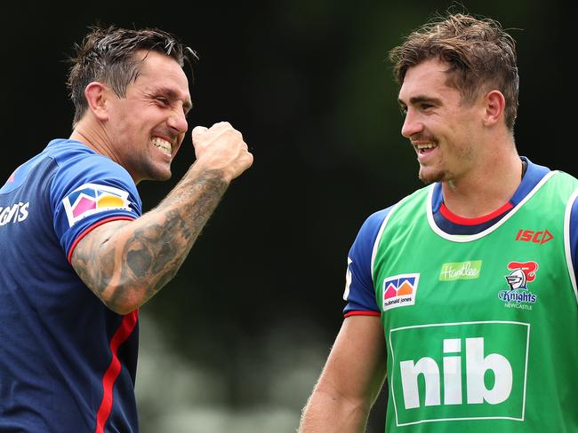 Mitchell Pearce during his first training session with his new club the Newcastle Knights since leaving the Sydney Roosters, at Wests Mayfield Newcastle. Mitchell with former Roosters team mate Connor Watson. Picture: Brett Costello