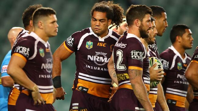 Adam Blair and the Broncos look on after a Roosters try.