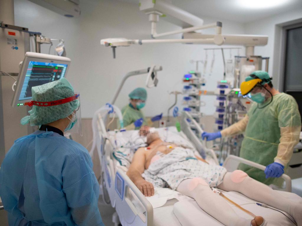 Nurses and doctor tend to a patient in the intensive care unit exclusively for COVID-19 patients at the Ixelles Hospital in Brussels. Picture: Aris Oikonomou/AFP