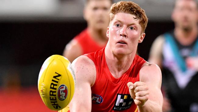 Matthew Rowell of the Suns in action during the Round 1 AFL match between the Gold Coast Suns and Port Adelaide Power at Metricon Stadium on the Gold Coast, Saturday, March 21, 2020. (AAP Image/Darren England) NO ARCHIVING, EDITORIAL USE ONLY