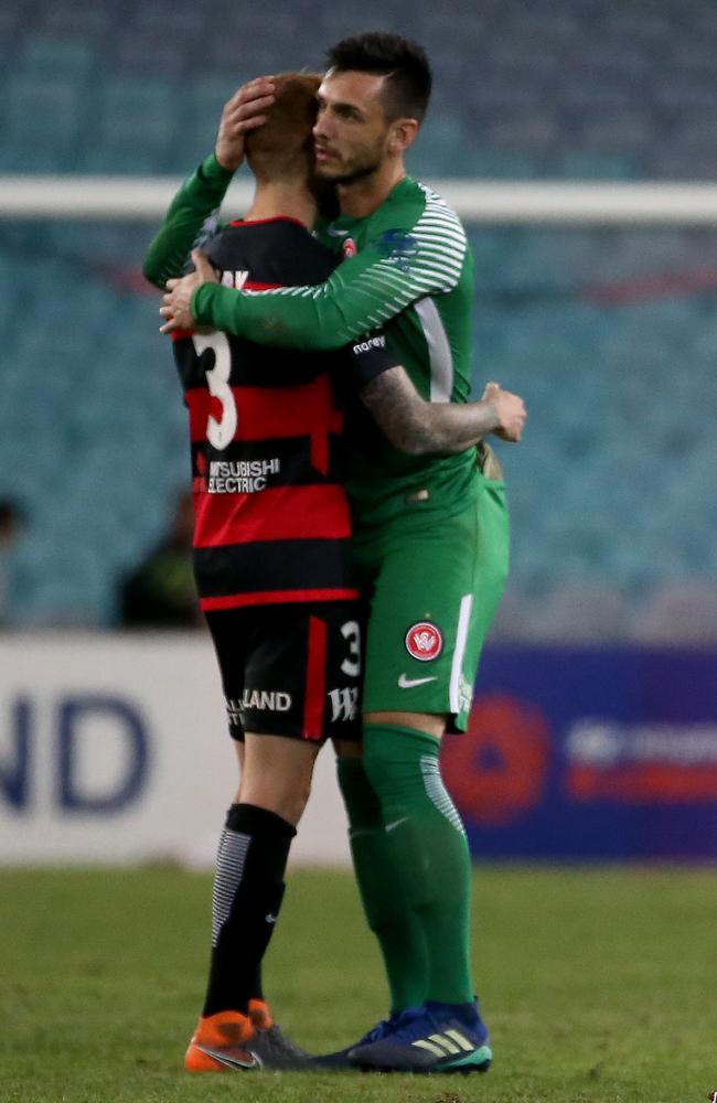 Shattered Wanderers players come together after the loss. Picture: Toby Zerna