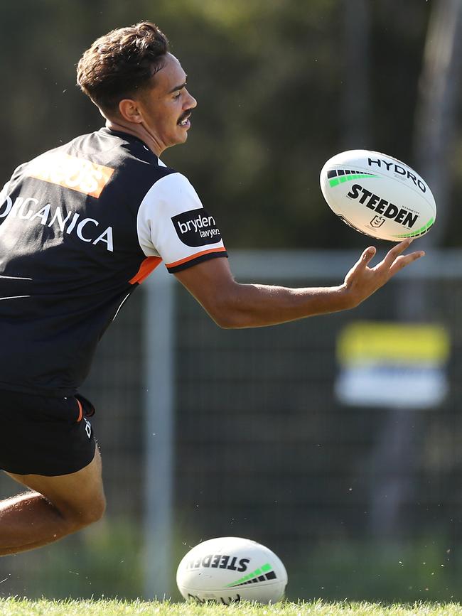 SYDNEY, AUSTRALIA – MARCH 09: Daine Laurie catches a kick during a Wests Tigers NRL training session at St Luke's Parrk North on March 09, 2021 in Sydney, Australia. (Photo by Mark Kolbe/Getty Images)