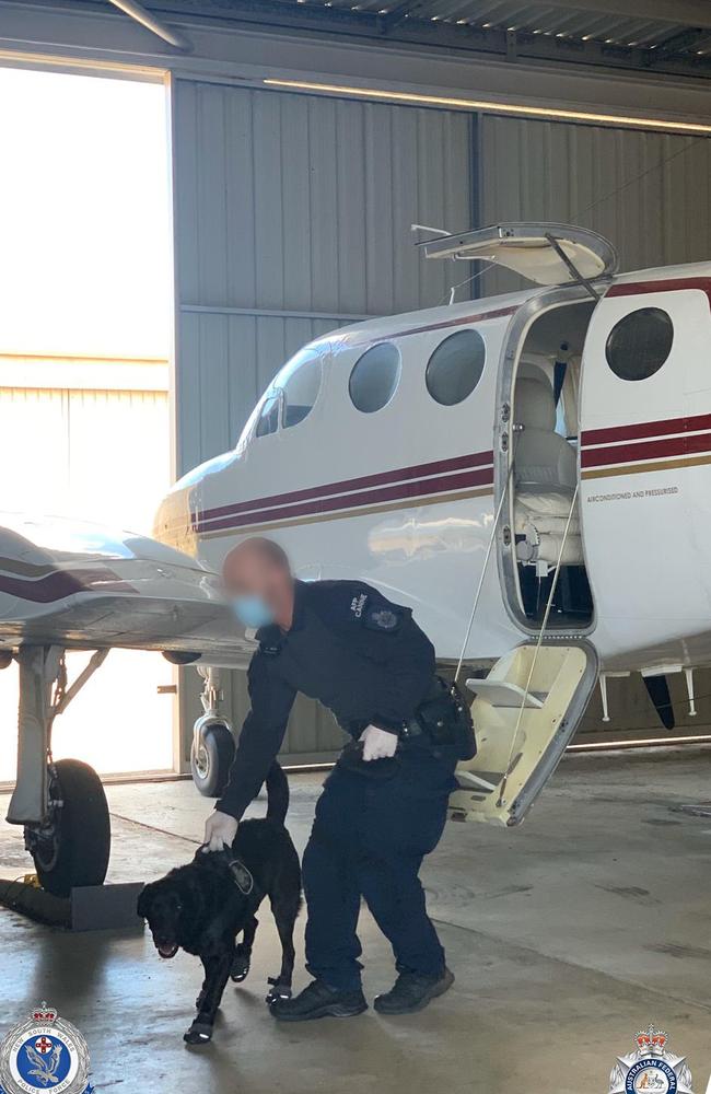 A plane in a hangar at Gold Coast Airport was searched. Picture: AFP