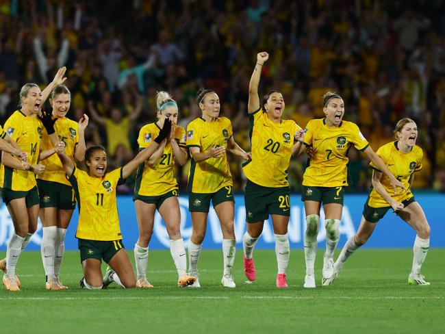 Matildas players celebrate winning the quarter final. Picture: Lachie Millard